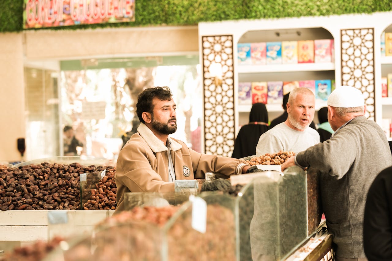 Vibrant scene of a traditional date market in Saudi Arabia with diverse people engaging.
